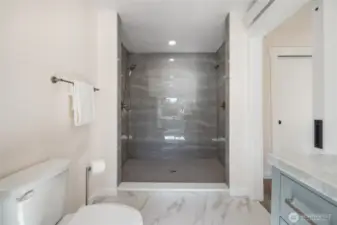 Gigantic walk-in shower in the primary bathroom. Double headed shower. Spare wand shower head in the bottom of the vanity if you want two wands in the shower.