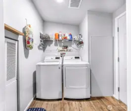 Laundry/utility room off of the kitchen with access to go outside.