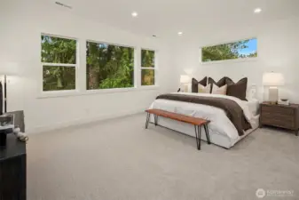 Designer primary suite with five-piece bath with heated floors