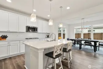 Chef’s kitchen with large island for gathering.