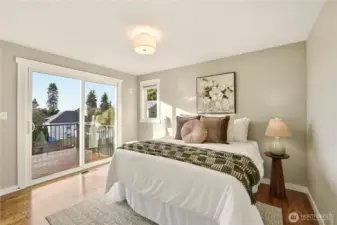 There are 3 bedrooms  on the main level including this spacious bedroom with access to the view deck!