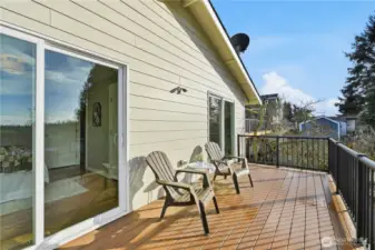 The rear west facing deck runs the entire length of the home and is accessed by 2 bedrooms.