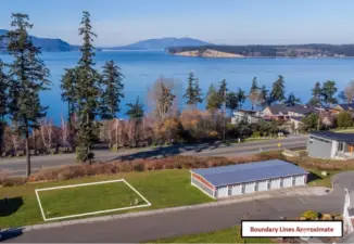 Lot in between two garages - no buildable lots beside