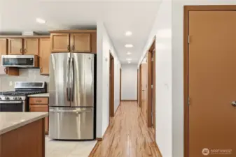 Kitchen, hallway and  pantry space closet on the right.
