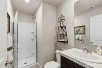 Convenient bathroom with shower on main floor. Photo's are for representational purposes only. Colors and finishes may differ.