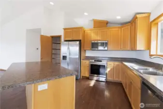 Large modern kitchen, all SS appliances stay. Good sized pantry with plenty of shelving.