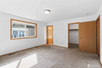 Primary suite with walk in closet & private bathroom.