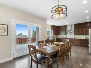 Great Room opens to Dining, Kitchen & French Doors to Deck.