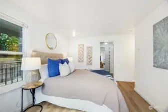 A view into the spacious walk-in closet and entry to the en-suite bathroom.