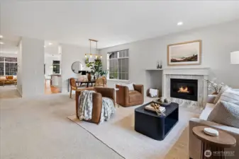 As you enter, a large living room seamlessly flows to the formal dining space.