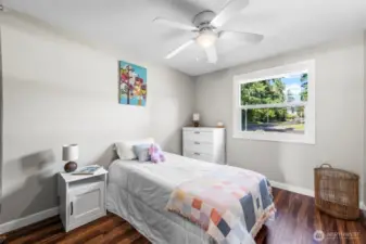 Secondary bedroom is in northeast corner of home and looks out over the front yard.