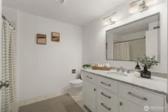 Full bathroom with newer vanity