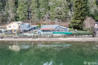 Both blue homes shown are included in sale.