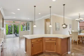 Cabinet space below the island is great as well. Also shows the entry leading you into the primary suite.