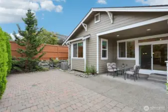 Backyard displays the privacy and how the next door neighbor sits so far above the commercial retention wall. You will never feel like you back up to neighbors.