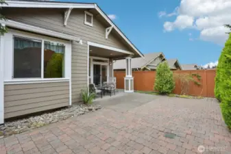 Another shot of the backyard surrounding by lush greenery and low maintenance.