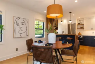 Dining space opens to kitchen.
