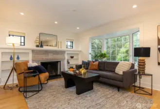 Built ins around soap stone fireplace.