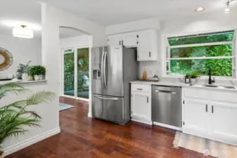 Kitchen with garden window overlooking the back yard oasis