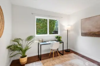 4th bedroom on lower level staged as a home office