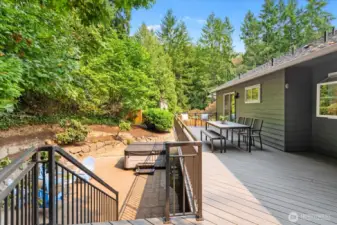 Steps down to the patio with hot tub that stays