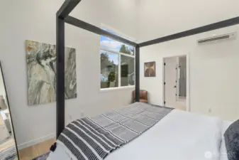 Primary bedroom with vaulted ceilings