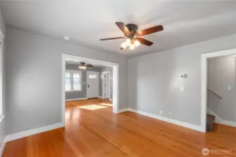 Dining room with view toward main entrance, living room & stairway to upper level.