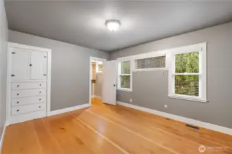 Primary bedroom with built-ins, walk in closet and ensuite bath.