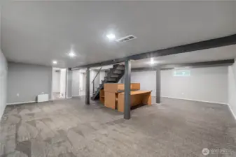 Rec Room with door to laundry on left and door to basement mud room on right.