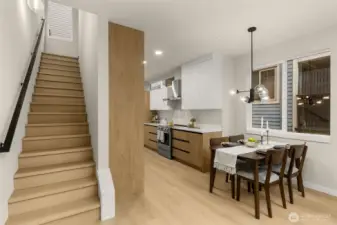 The dining room opens into a a spacious and bright living room with a large loft overlooking  the space below.