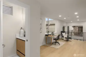 Tucked behind the office space, a half bath for convenience