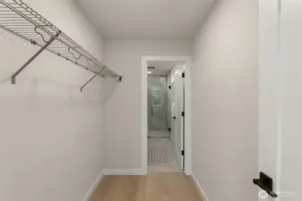 A large walk-in closet connects the en-suite bath to the primary