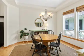 Hardwood floors, high ceilings and large windows carry through the dining area.