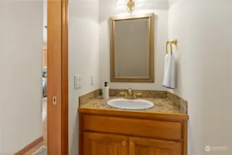 Convenient half bath is located just off the main level hallway.