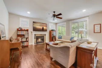 Gather in the inviting family room, complete with a gas fireplace and large windows overlooking the backyard.