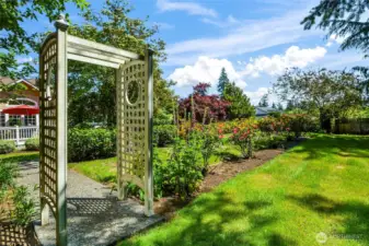 Breathtaking landscaping with rose garden, mature trees, perennials and scrubs that have been meticulously maintained and enjoyed in this fully fenced private backyard.