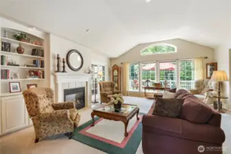 Enjoy the living with beautiful custom built-in book cases and gas fireplace