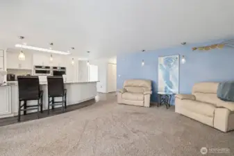 Down the hall is the laundry room, half bath and access to the garage to the RIGHT, and the front door and living room to the LEFT.