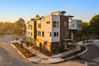 Golden hour settles across Pine Ridge, capturing the warmth and architectural beauty that define this exclusive enclave.