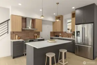 The kitchen, where luxury meets function, featuring stainless steel Bosch appliances & scratch resistant luxury quartz countertops.