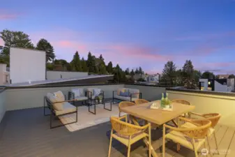 Evenings feel magical on this rooftop perch, with skies that shift from cotton candy to city sparkle.