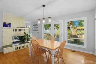 Great kitchen view of the double-sided fireplace and easy access to the back patio.