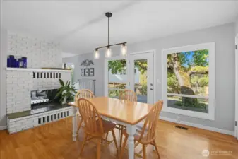 Great kitchen view of the double-sided fireplace and easy access to the back patio.