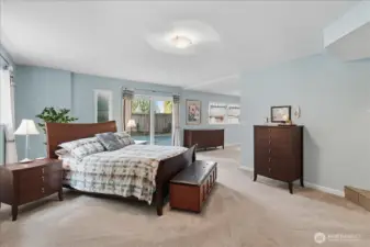 Slider off the primary bedroom with direct access to the pool and patio.