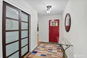 Entry hall with large coat closet.