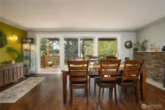 Lively jewel colored accent wall blends the inside & out…