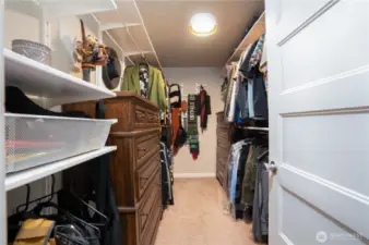 Spacious primary bedroom walk-in closet…