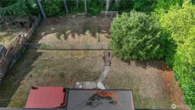 This yard is a blank palette just waiting for you…there is an old sand area on the lower level that could be used for a fire pit or sand volley ball court or a badmitten net…