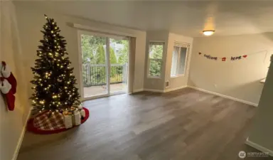 Current open-concept living and dining rooms