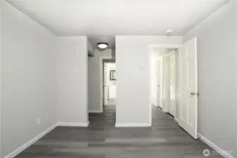 Primary bedroom with adjoining closet and bathroom